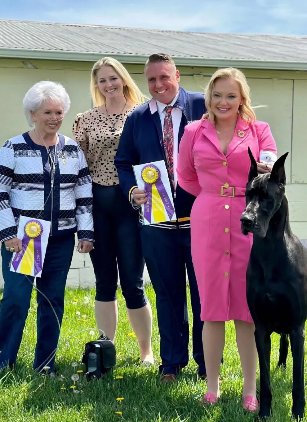 Dan at a dog show with a Great Dane and award ribbons