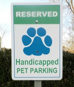 Accessible parking sign for pets with limited mobility at Animal Therapy Center